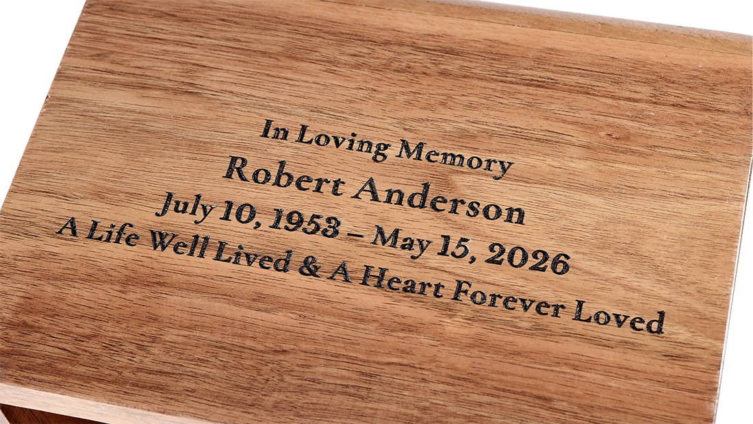 Base Solid Walnut Cremation Urn by Royal Memorials, showing a close-up detail of custom personalized engraving