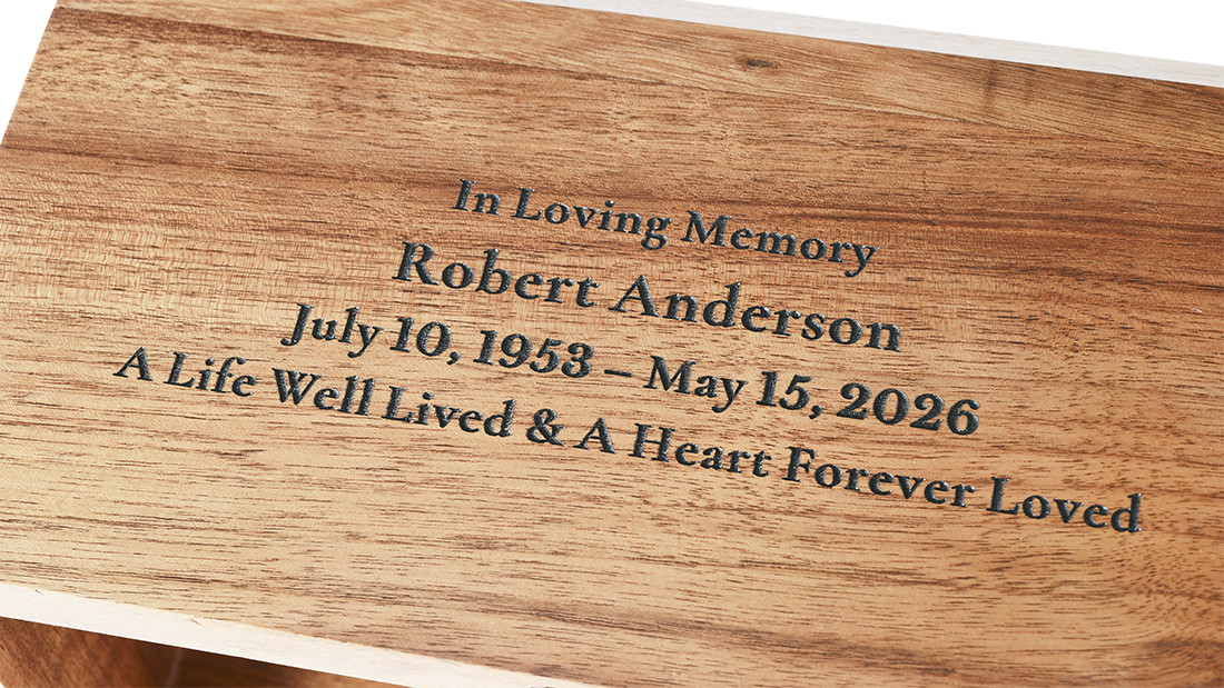 Bevel Solid Walnut Cremation Urn for Ashes by Royal Memorials, showing a close-up detail of custom personalized engraving