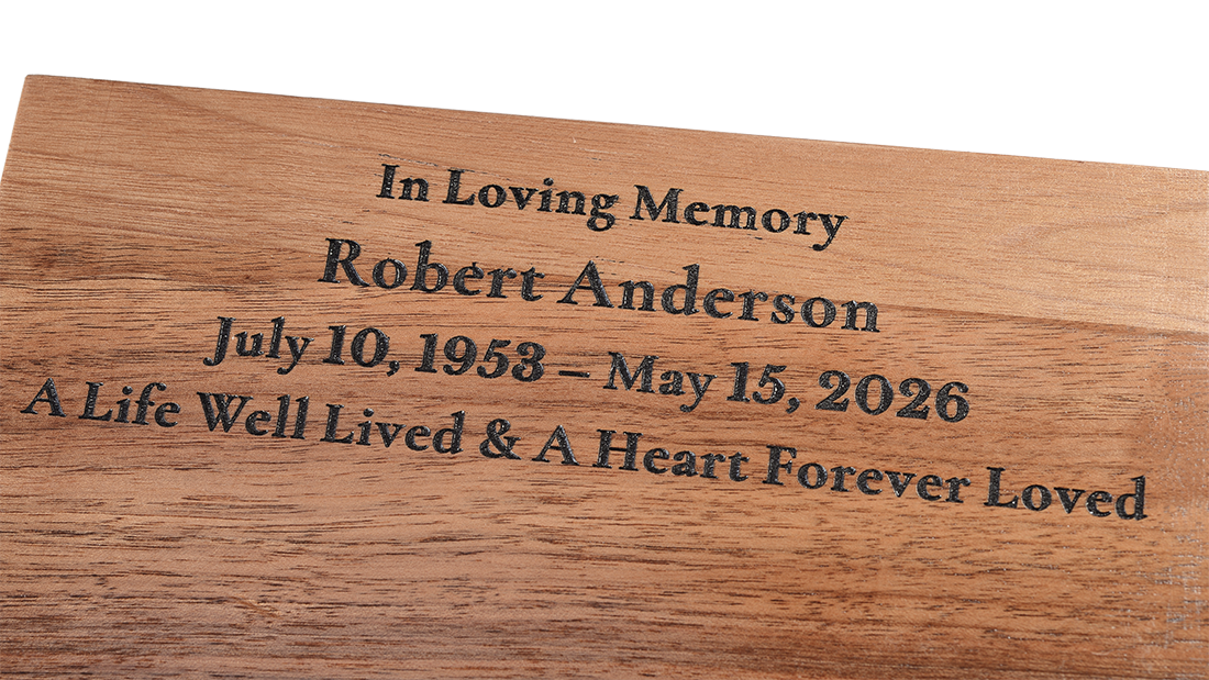 Dual-Layer Walnut Cremation Urn for Ashes by Royal Memorials, showing a close-up detail of custom personalized engraving