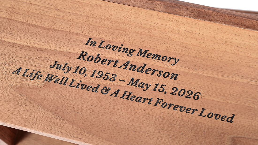 Modern Walnut Flat-Top Cremation Urn for Ashes by Royal Memorials, showing a close-up detail of custom personalized engraving