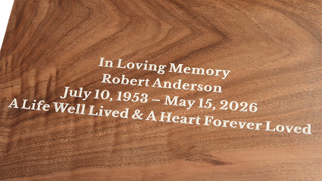 Monolith Solid Walnut Cremation Urn for Ashes by Royal Memorials, showing a close-up detail of custom personalized engraving