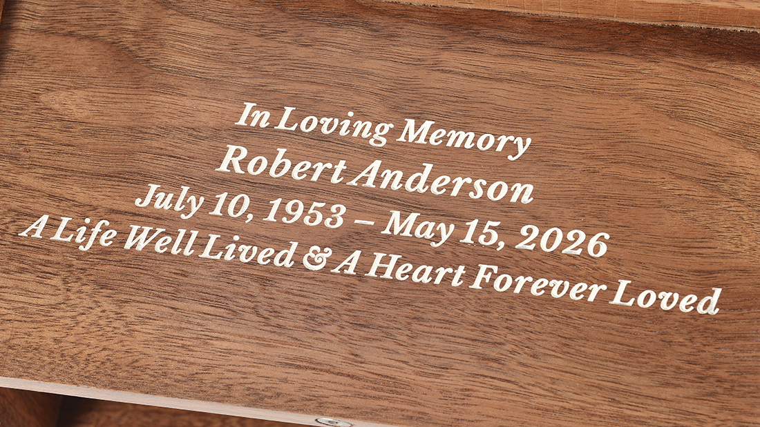 Roman Column Walnut Cremation Urn for Ashes by Royal Memorials, showing a close-up detail of custom personalized engraving