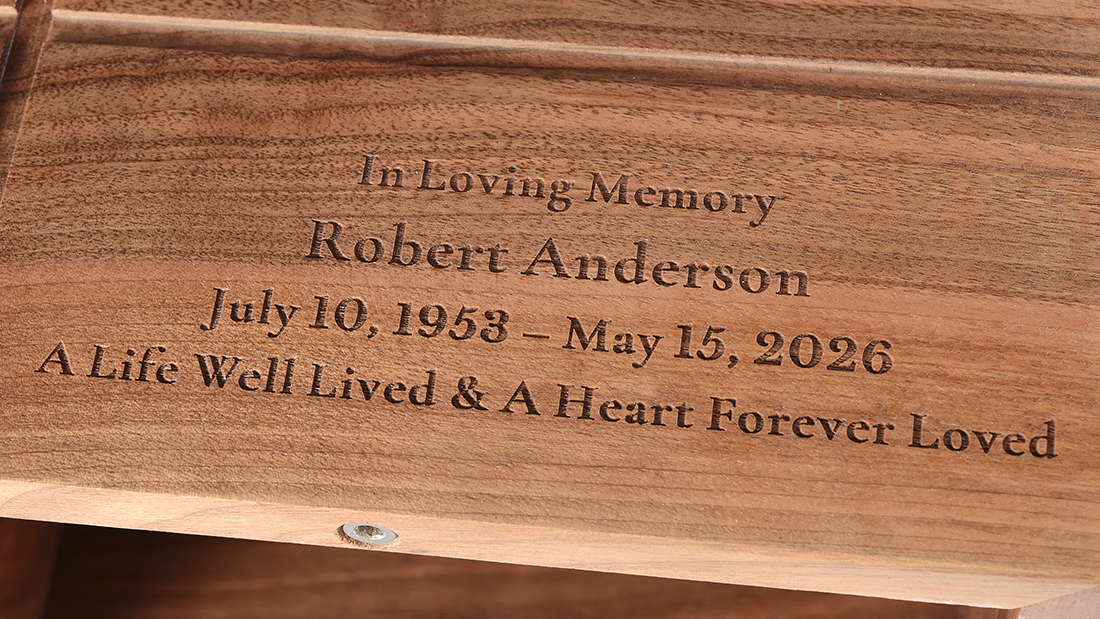Subtle Cross Engraved Walnut Cremation Urn for Ashes by Royal Memorials, showing a close-up detail of custom personalized engraving