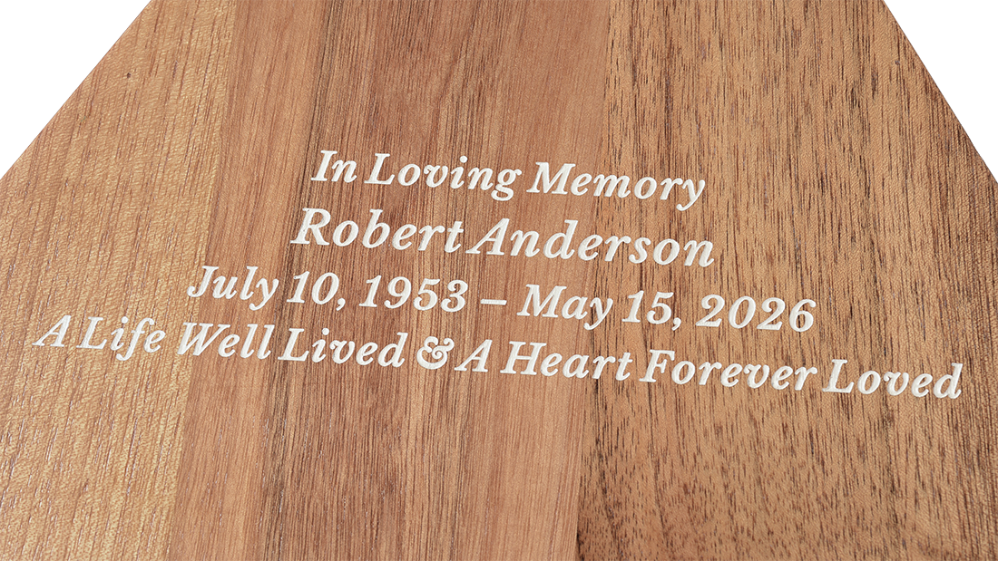 Close-up detail of personalized engraving on the Triangular Pyramid Walnut Urn for Ashes
