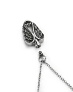 Top view showing unscrewed top bail with rubber gasket seal and inner chamber of angel wings heart cremation necklace