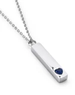 Angled view of Blue Crystal Heart Bar Cremation Necklace for Ashes featuring a raised blue heart crystal accent