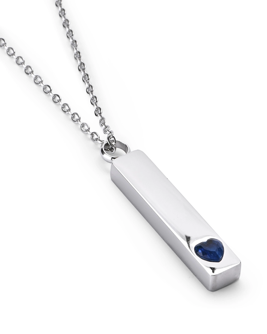 Blue Crystal Heart Bar Cremation Necklace for Ashes - Main View Angled view of Blue Crystal Heart Bar Cremation Necklace for Ashes featuring a raised blue heart crystal accent