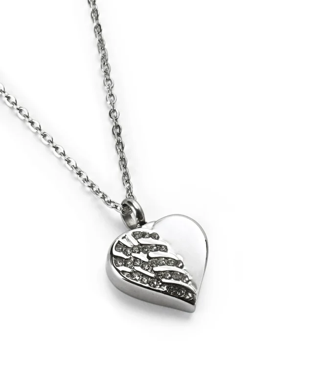 Angled view of crystal angel wing heart cremation necklace for ashes in polished stainless steel