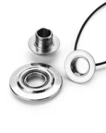 Disassembled polished titanium cremation necklace showing the threaded waterproof memory chamber and smooth ball bearing