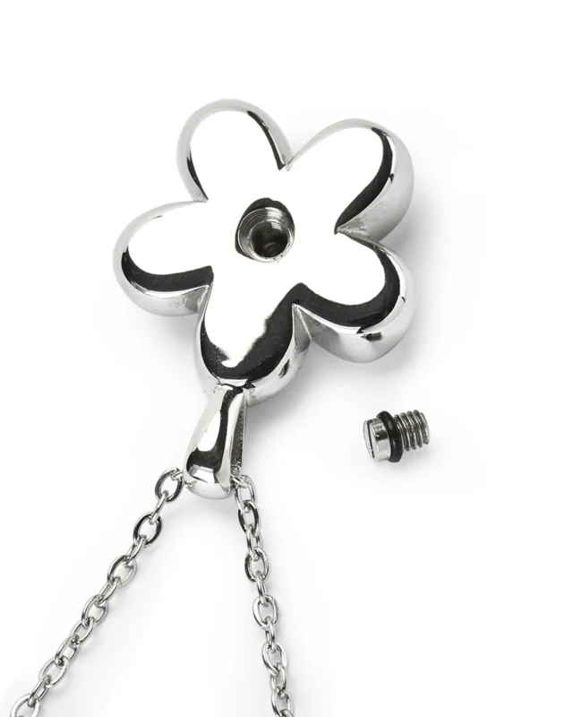Back view of flower cremation necklace showing secure screw-in back opening for ashes