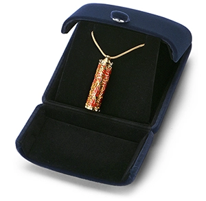 Gold cylindrical keepsake jewelry pendant necklace with red maple leaf pattern by Royal Memorials, displayed in a navy blue velvet box