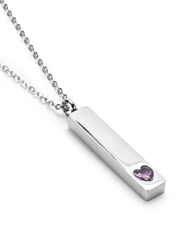Angled view of Lavender Crystal Heart Bar Cremation Necklace for Ashes featuring a raised lavender heart crystal accent