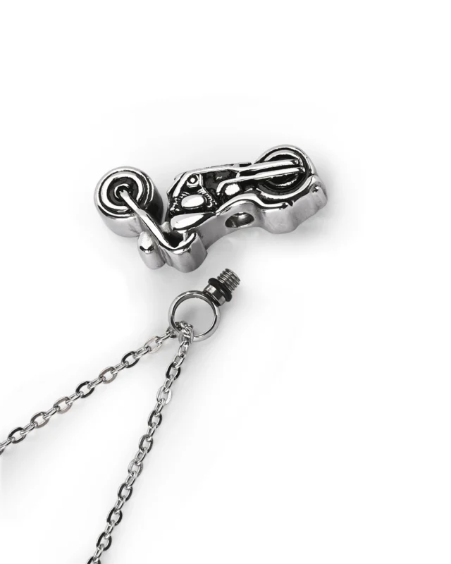 Top view showing unscrewed bail opening of motorcycle cremation necklace for ashes