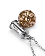 Detail view of stainless steel urn cylinder engraved with 'Always in my heart' paired with rose gold filigree cage