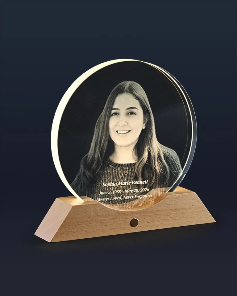 Side profile of round memorial glass light showing solid wood LED base