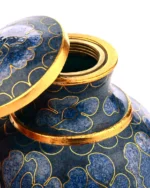 Close up of floral cloisonne enamel and brass rim on keepsake urn