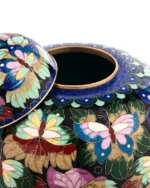 Close-up of intricate cloisonne wire-work and vibrant butterfly patterns on Royal Memorials urn