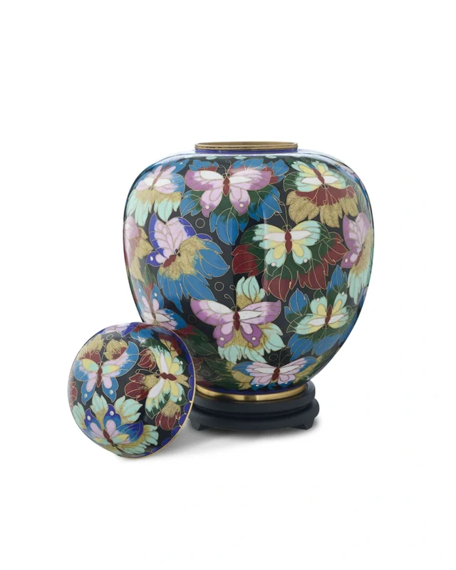 Royal Memorials Butterfly Garden cloisonne cremation urn with matching lid placed beside the urn