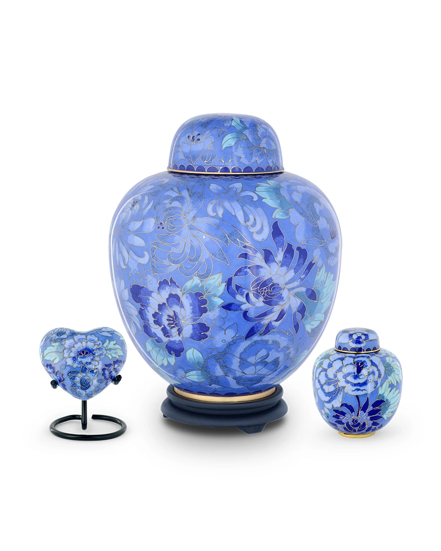 Exquisite Royal Memorials Cloisonne cremation urn set featuring floral enamel designs and matching keepsakes on display
