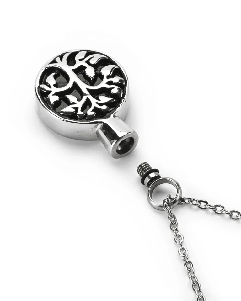 Top view showing unscrewed top bail with rubber gasket seal and inner chamber of tree of life cremation necklace