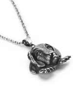 Angled view of dog stainless steel pendant highlighting three-dimensional fur textures and paws