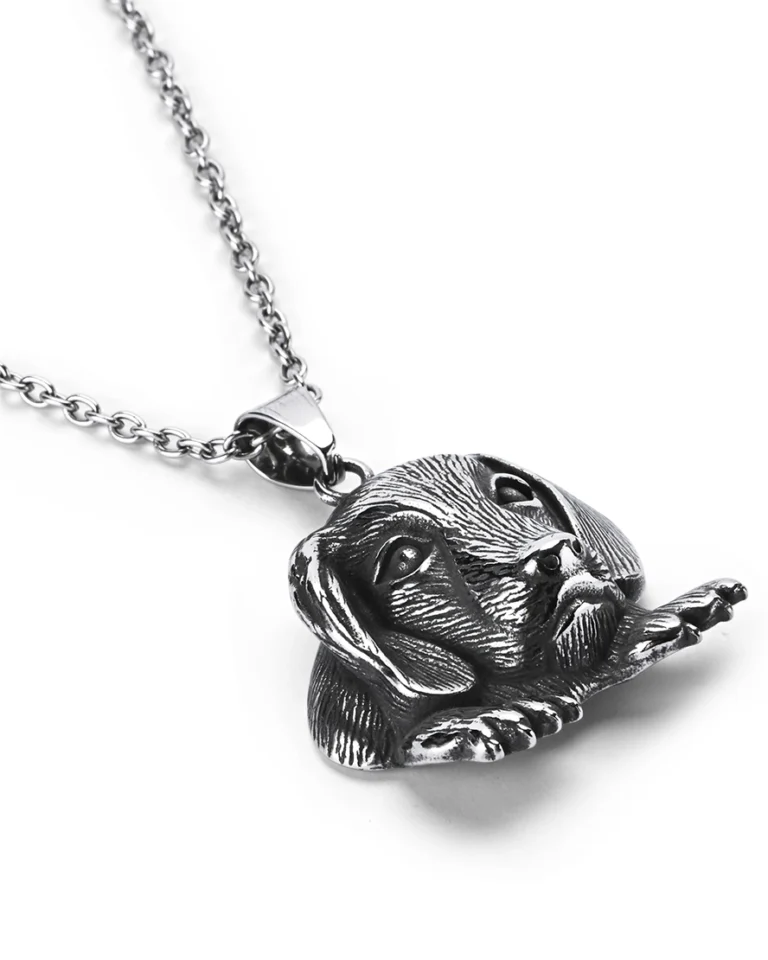Angled view of dog stainless steel pendant highlighting three-dimensional fur textures and paws