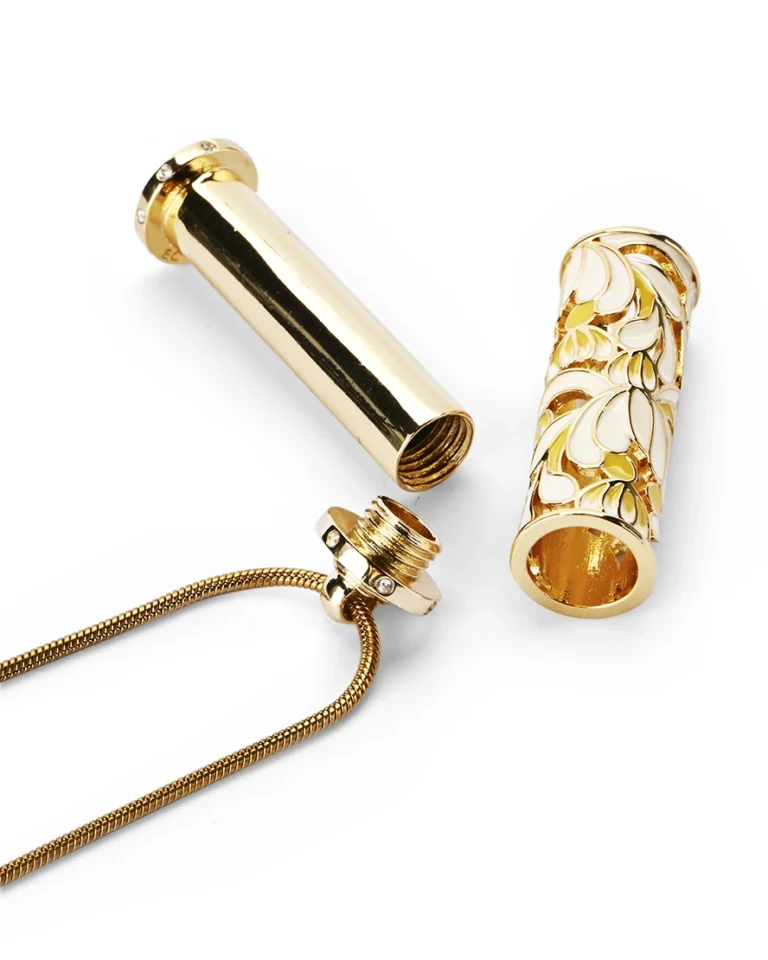 Ivory lily cloisonne cremation necklace showing screw-in top bail and inner memorial chamber
