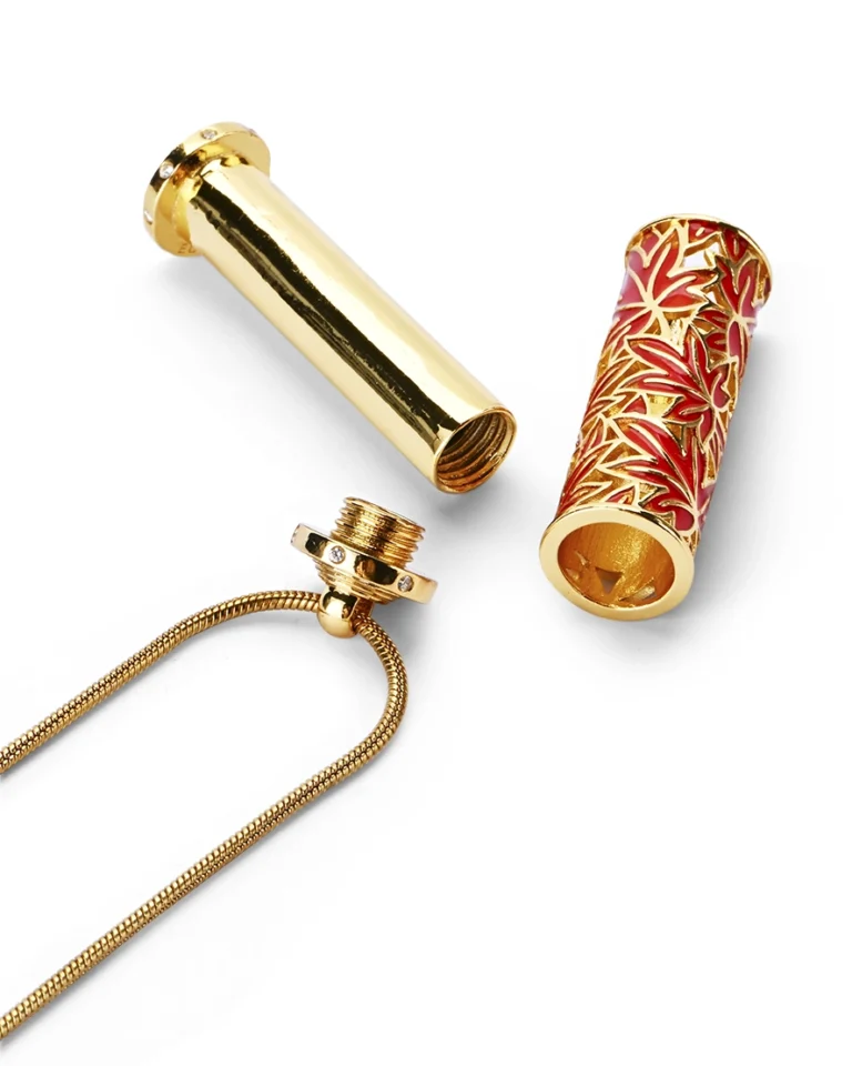 Red maple leaf cloisonne cremation necklace showing screw-in top bail and inner memorial chamber