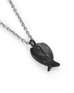 Black angel wing urn necklace for ashes with overlapping sculpted feathers in 316L stainless steel