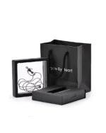 Black cat moon urn necklace displayed in a presentation frame with gift packaging