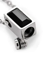 Bottom screw opening and rubber gasket on black rectangle urn necklace for ashes