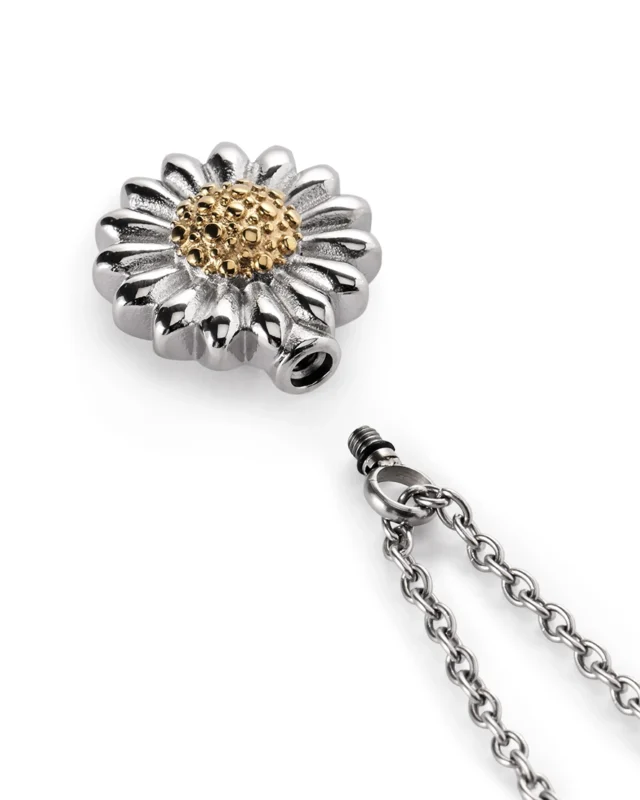 Screw-in top opening and rubber gasket on two-tone daisy urn necklace for ashes