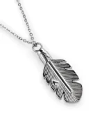 Angled view of stainless steel feather cremation necklace showing recessed line detailing