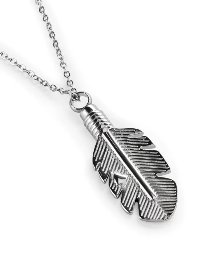 Angled view of stainless steel feather cremation necklace showing recessed line detailing