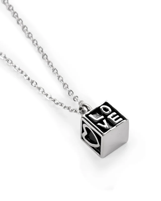 Heart cube cremation necklace showing LOVE lettering and heart motif on stainless steel pendant