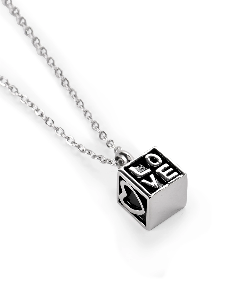 Heart Cube Cremation Necklace LOVE Detail Heart cube cremation necklace showing LOVE lettering and heart motif on stainless steel pendant