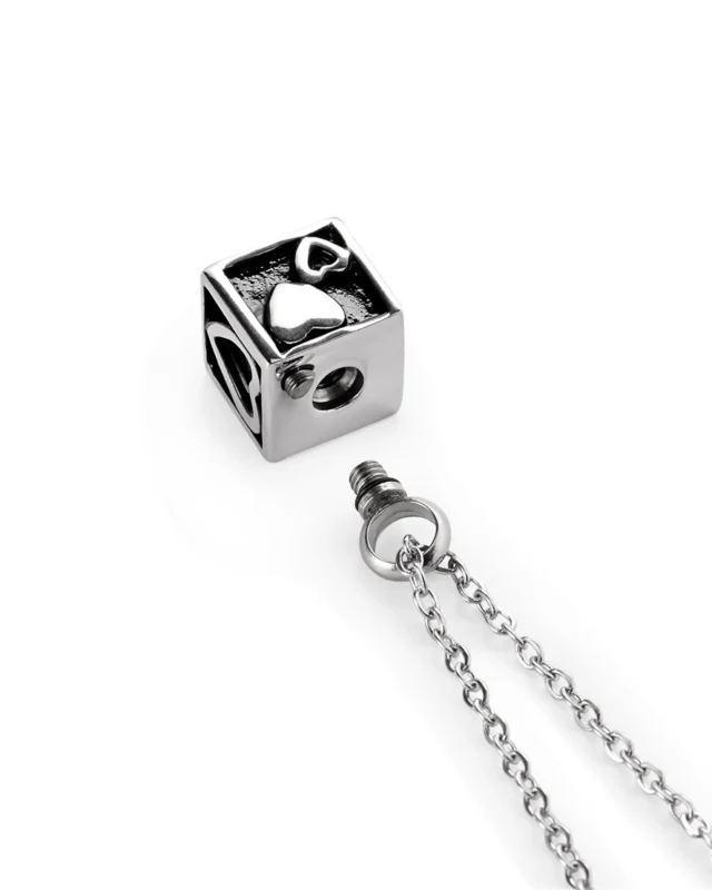 Screw-in top opening and rubber gasket on heart cube urn necklace for ashes