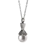 Front view of pearl urn necklace with luminous pearl-look drop and crystal-accented silver-tone setting
