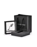 Silver angel wing urn necklace displayed in a floating presentation frame with gift packaging