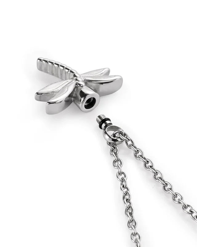 Screw-in top closure and rubber gasket on silver dragonfly urn necklace for ashes