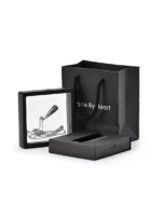 Teardrop urn necklace with heart detail displayed in a presentation frame with gift packaging