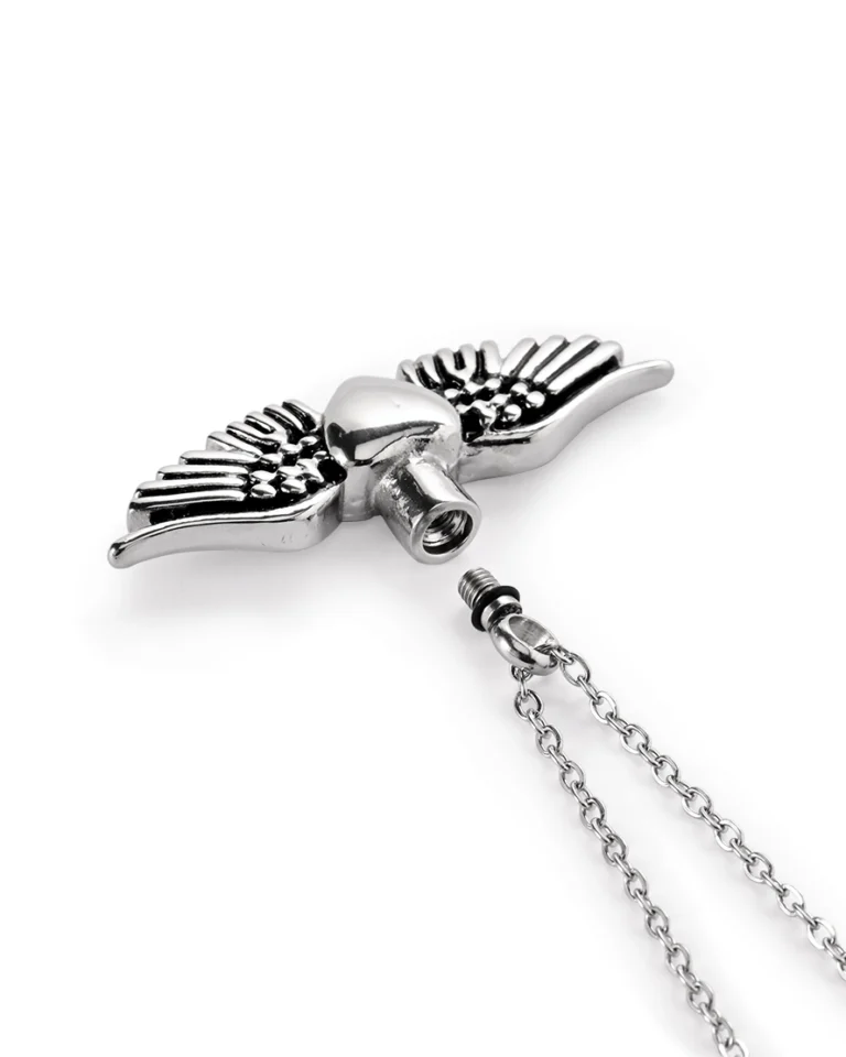 Screw-in top opening and rubber gasket on winged heart urn necklace for ashes
