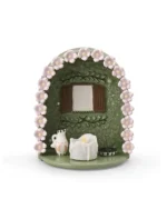 Floral Window pet memorial shrine with green arch, raised pink flowers, brown window shutters, and LED candle