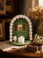 Floral Window pet memorial shrine with golden retriever photo, illuminated LED candle, and dog collar on a wooden table