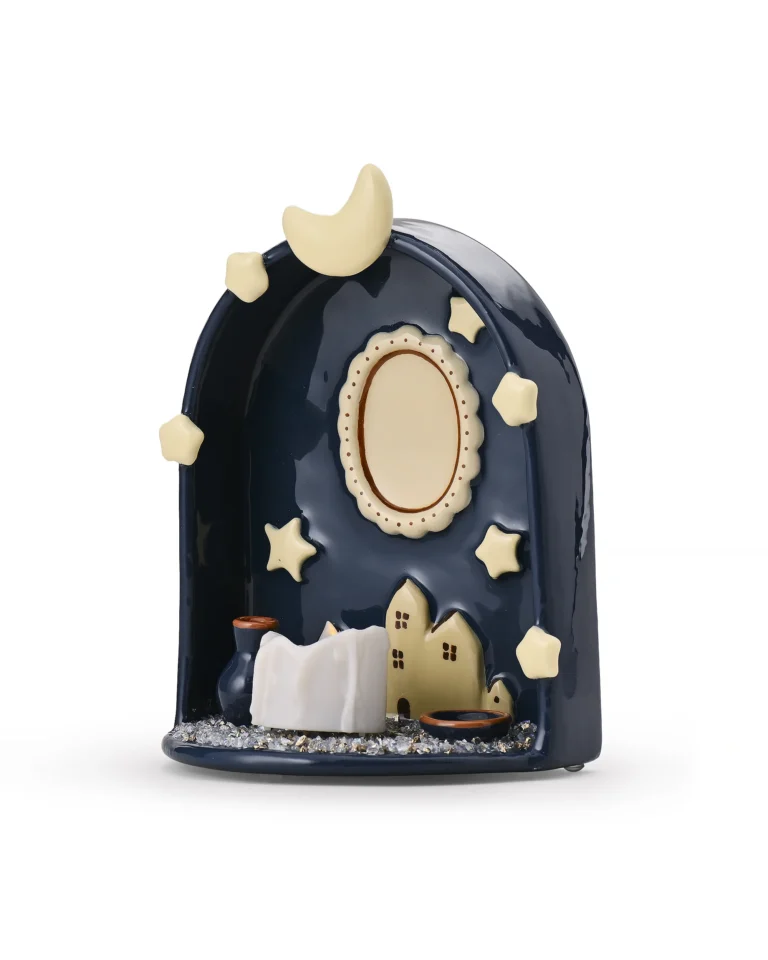 Angled view of Moon & Stars pet memorial shrine showing the curved ABS body, miniature houses, and LED candle